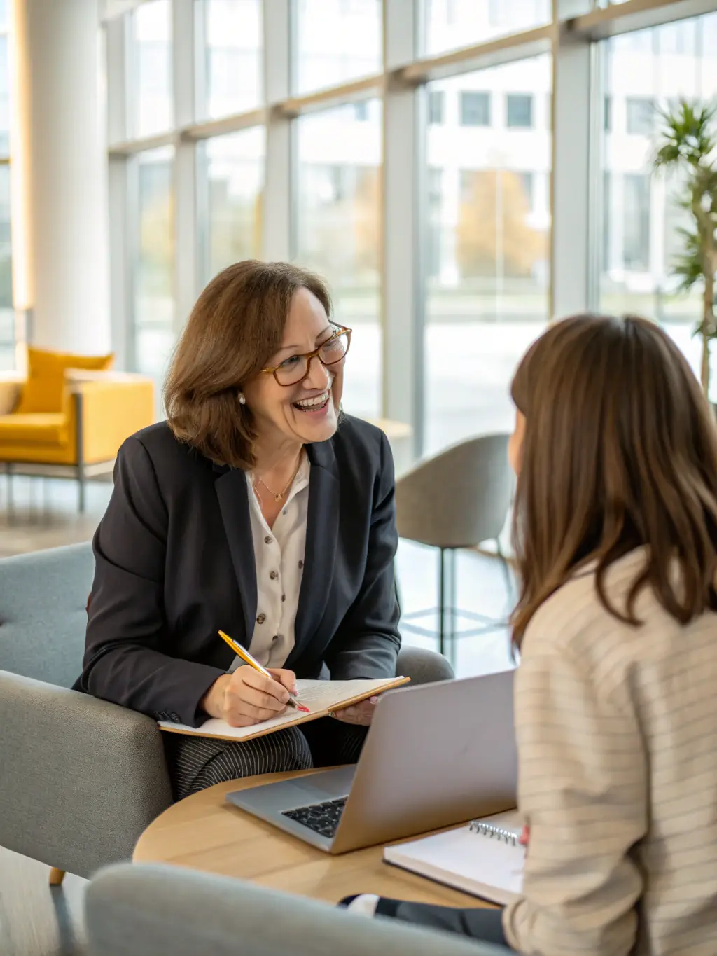 A professional South African business owner smiling confidently during a coaching session, showcasing the impact of the Leadership Development Program.